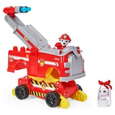 a toy firetruck with two dogs on the back