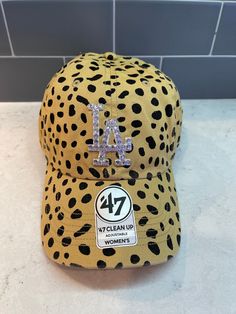 Light Tan 'Cheetah' LA Dodgers '47 Brand hat that is hand-blinged with clear Crystals by me. * Relaxed Fit, Garment Washed * Self Fabric Strap for a OSFA * Front: Raised Embroidery Logo * Cotton Twill ✨ I meticulously hand-bling each hat ✨ Tshirt And Jeans, Bling Hat, Custom Fitted Hats, The Cheetah, Raised Embroidery, Unique Hats, Fabric Strap, Simple Tshirt, 47 Brand