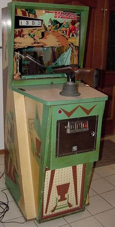 an old fashioned video game machine sitting on the floor