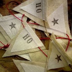 several white and red pennants with stars on them, tied together in twine