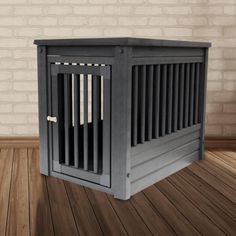 a dog crate sitting on top of a wooden floor