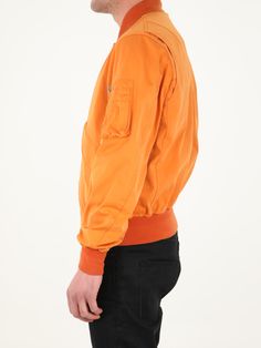 Long-sleeved orange jacket. It features front zip closure, two side buttoned flap pockets, one zipped pocket on left sleeve and contrasting details on neck, cuffs and hem. The model is 184cm tall and wears size 48. Size nationality: IT Product number: 35774814 Product code: 22CTCUC04064A06105434 Composition: 60% polyester, 40% polyamide Urban Orange Long Sleeve Outerwear, Urban Orange Outerwear For Fall, Orange Long-sleeve Outerwear With Pockets, Orange Long Sleeve Outerwear With Pockets, Orange Collared Outerwear For Work, Collared Orange Outerwear For Work, Orange Long Sleeve Outerwear For Work, Paul Harvey, Orange Jacket