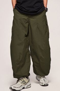 Price: $42.00 Material: 40% Nylon + 60% Polyester Size: S, M, L, XL, 2XL Color: Black, Army Green Applicable Season: Spring, Summer Green Cargo Style Wide-leg Parachute Pants, Military Style Wide Leg Cargo Bottoms, Military Cargo Style Wide Leg Bottoms, Military Wide Leg Cargo Bottoms, Combat Cargo Pants With Pockets, Combat Parachute Pants With Side Pockets, Military Style Cargo Bottoms, Combat Style Wide Leg Bottoms With Cargo Pockets, Military Style Cargo Straight Pants