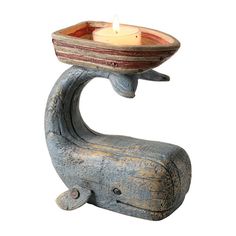 a candle holder with a bowl on it