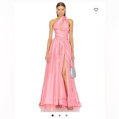 a woman in a pink dress is on the website