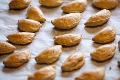 some kind of food that is laying on a piece of wax paper and ready to be baked