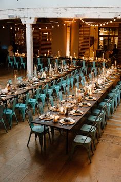 the tables are set up with candles and place settings for an event or celebration,