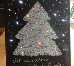 a christmas card with a lit up tree on it