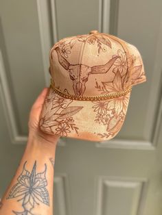 This hat fits *MOST* headsizes and has an adjustable back strap.  Each hat is hand burned and can vary slightly. Ways To Style Sweatpants, Burned Hats, Skull Sunflower, Hat Burning, Cool Belt Buckles, Tan Summer, Lainey Wilson, Country Hats, Longhorn Cow