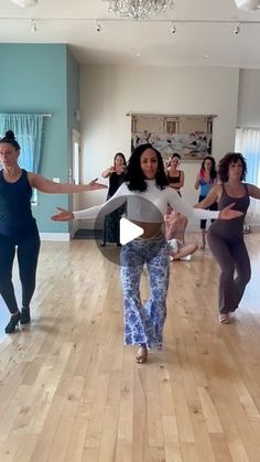 a group of women dancing in a dance studio