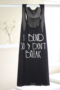 a black tank top that says, i bend so don't break on it