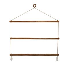 a wooden shelf hanging from a rope with two white lights attached to the top and bottom