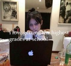 a woman sitting in front of a laptop computer with the caption i love getting the highest grade at school