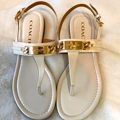 Never Worn Authentic Bone Coach Sandals With Gold Emblem. Coach Sandals With Buckle Closure For Summer, Coach Sandals With Ankle Strap And Buckle Closure, Coach Sandals With Buckle Closure And Round Toe, Chic Coach Sandals With Buckle Closure, Coach Leather Sandals For Vacation, Chic Coach Sandals With Heel Strap, Trendy Coach Leather Sandals, Elegant Coach Sandals For Spring, Coach Open Toe Adjustable Sandals