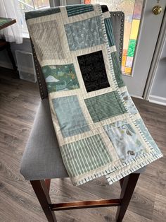 a chair with a patchwork quilt on it