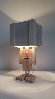 a lamp that is sitting on top of a table in the middle of a room