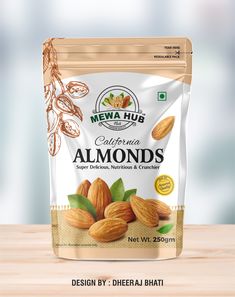 almonds with leaves and nuts on wooden table