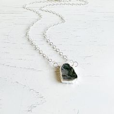 A simple yet charming staple, featuring a gemstone pendant. It's an everyday favorite that always feels special. GEMSTONE: Moss agate SIZE: ~ 0.5" long CHAIN: 18" long sterling silver CLOSURE: Lobster clasp Silver Necklace Simple, Long Chain, Agate Gemstone, Moss Agate, Layered Necklaces, Gemstone Pendant, Crystal Necklace, Lobster Clasp, Different Colors