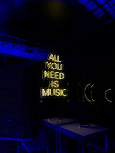 all you need is music neon sign in dark room