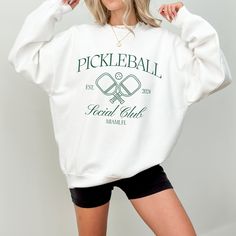 Custom Pickleball Sweatshirt Personalized Pickleball Bachelorette Crewneck Bridesmaids Matching Sweater Pickleball League Sweatshirt Gift For Pickleball Player Bach Party Merch Production time: 1 to 3 days Shipping time: 2 to 5 days ☀️ Product Details Unisex heavy blend Crewneck Sweatshirt There are no itchy side seams on these sweaters. 50% cotton, 50% polyester Medium-heavy fabric (8.0 oz/yd² (271.25 g/m Loose fit Runs true to size ☀️ Sizing Please see size guide in listing photos for measurem Collegiate Crew Neck Tennis Tops, Crew Neck Tennis Sweatshirt For Sports Season, White Graphic Print Tennis Sweatshirt, Sporty White Tennis Sweatshirt, White Long Sleeve Tennis Sweatshirt, White Tennis Top With Team Name, Sporty Tennis Tops With Team Name, White Sweatshirt For Tennis Sports Season, Pickleball Bachelorette