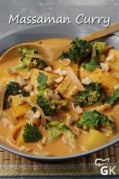 a bowl filled with broccoli and chicken curry