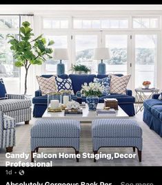 a living room filled with blue couches and chairs