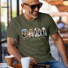 🔥 Use code SAVEMORE at checkout for 35% OFF with 3+ item order. Don't miss out! 🔥 Celebrate Father's Day with our Personalized Da Da Shirt. Featuring your kids' names and a custom photo, this t-shirt is a heartfelt way for Daddy to showcase his pride and love for his children.  Ideal as a thoughtful gift for your husband or Daddy, this custom photo t-shirt makes a unique and memorable present for Father's Day or any special occasion. Show him how much he means to the family with this personali Dada Shirt, Father Presents, Kids Names, Personalized T Shirts, Kid Names, Custom Photo, Custom Clothes, The Family, Fathers Day Gifts