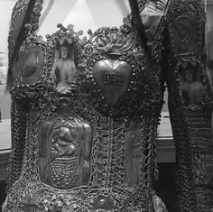 an elaborately designed dress is shown in black and white