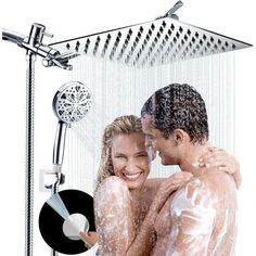 a man and woman are in the shower with their arms around each other as they smile