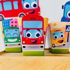 three colorful boxes with cartoon characters on them