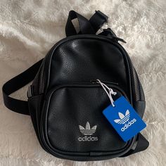 Adidas Mini Backpack Trendy Black Backpack For Back To School, Black Leather Shoulder Backpack For Back To School, Adidas Backpack For Everyday And Back To School, Adidas Backpack With Adjustable Strap, Back To School Adidas Backpack, Trendy Black Backpack With Zipper Pocket, Casual Black Backpack With Removable Pouch, Adidas School Bag With Adjustable Strap, Adidas Everyday Bags For Back To School