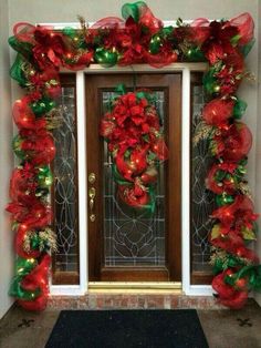 a door decorated with red and green christmas decorations