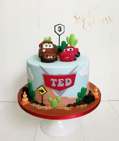 a birthday cake with cars on it