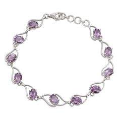 Eleven sparkling carats of lilac amethyst ride the waves in this original link bracelet from Alok Jain. The bracelet is crafted of sterling silver with a gleaming rhodium plated finish. It closes with a lobster claw clasp. Amethyst Bracelet In Fine Jewelry Style, Amethyst Bracelet Fine Jewelry, Purple Fine Jewelry Bracelet, Modern Purple Bracelet Jewelry, Classic Purple Bracelet Jewelry, Formal Silver Amethyst Bracelet, Classic Sterling Silver Purple Bracelets, Lavender Amethyst Bracelet, Silver Oval Amethyst Bracelets