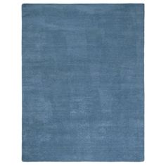 a blue rug on a white background with no one in the room to see it