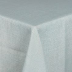 a plain white table cloth is folded up