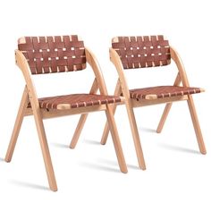 two wooden chairs sitting next to each other