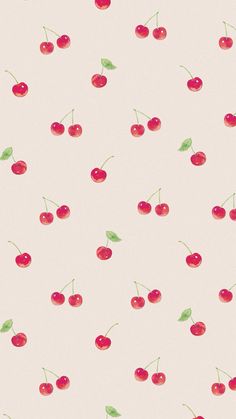 cherries on a white background with green leaves