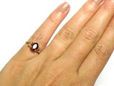 "14k Yellow Gold Garnet Diamond Ring Garnet is the birthstone for the month of January Size 3.5 can be a pinky ring or resized 3/4 ct Oval Garnet Diamond .01 ctw Total weight: 2.3 Grams 72313-1822 FEEL FREE TO MESSAGE ME IF YOU HAVE ANY QUESTIONS OR WISH TO SEE MORE PICTURES * Back to Shop Watch and Wares? https://www.etsy.com/shop/watchandwares * Ready to purchase? Click the green button \"Add to cart\" * Have a question? Click the button \"Ask a question\" * Want to save for later/favorite the Red Multi-stone Birthstone Ring, Red Multi-stone Birthstone Ring Gift, Garnet And Diamond Ring, Ring Gifts, January Birthstone, Green Button, Pinky Ring, Garnet Rings, Red Garnet