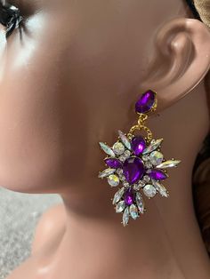 Watch video of earrings for better view Pierced ears. Back is gold tone Alloy metal * 2.6 inch long Purple gold crystal earrings Long purple earrings Purple rhinestone earrings Purple tear drop earrings Eggplant earrings Big purple earrings Aurora borealis purple earring Pierced post earrings