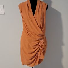 Fashion Nova Faux Wrap V Neck Sleeveless Dress Has Back Zipper. Adjustable Tie At The Bottom Of Dress To Adjust To Your Liking. Shell: 100% Polyester And Lining 100% Polyester. Size M Peach Color Spring Sleeveless Draped Dress For Night Out, Chic Draped Sleeveless Dress For Spring, Casual Draped Mini Dress For Spring, Orange V-neck Mini Dress For Evening, V Neck Sleeveless Dress, Summer Orange V-neck Mini Dress, Orange V-neck Sleeveless Summer Dress, Orange V-neck Beachwear Dress, Orange Patchwork V-neck Dress