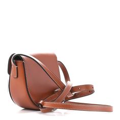 This is an authentic CELINE Smooth Calfskin Triomphe Mini Besace Crossbody in Tan. This stylish shoulder bag is crafted of luxuriously smooth calfskin in brown. The bag features an adjustable cross-body shoulder strap with polished gold hardware. The flap opens to a brown leather interior. Celine Box, Stylish Shoulder Bag, Black Cross Body Bag, Flap Bag, Leather Interior, Tri Color, Belt Bag, Gold Hardware, Cross Body