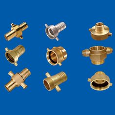 various types of brass fittings for different kinds of pipes and valves on a blue background