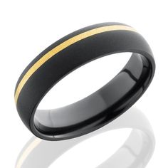 a black and gold wedding ring with an inside stripe on the outside, set in 18k yellow gold