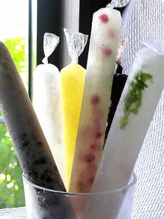 an assortment of toothbrushes in a cup on a window sill with text overlay