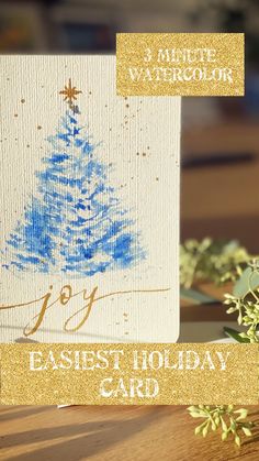 an easel card with a blue christmas tree on it and the words, happy easter holiday card