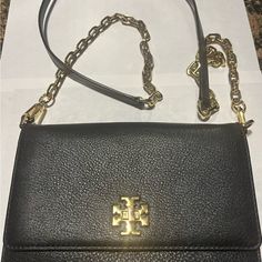 Tory Burch Stylish Black Leather Crossbody Bag. Leather And Chain Crossbody Strap With 23.5” Drop (Removable) Flap With Double T Closure - Closure Knob Slightly Discolored T Monogram Fabric Interior Flap Height 6”. Length 7 3/4”. Two Sets Of 8 Card Pockets 1 Front Zipper Pocket 1 Back Wall Slip Pocket On Exterior 1 Interior Back Wall Slip Pocket Pebbled Leather Crossbody Bag, T Monogram, Black Leather Crossbody Bag, Black Pebbles, Tory Burch Bag, Crossbody Strap, Leather Crossbody Bag, Pebbled Leather, Front Zipper