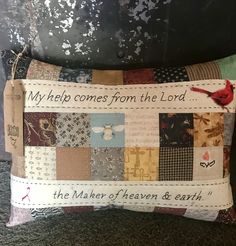 a decorative pillow with words written on it and pictures of birds in the patchwork