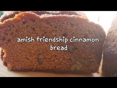 two pieces of bread sitting on top of a wooden cutting board with the words, amish friends cinnamon bread