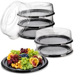 four clear plastic plates with fruit on them